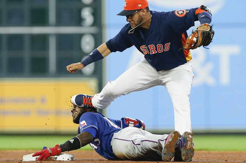 HOUSTON, TX - JULY 29:  Yuli Gurriel #10 of the Houston Astros steps on the face of...