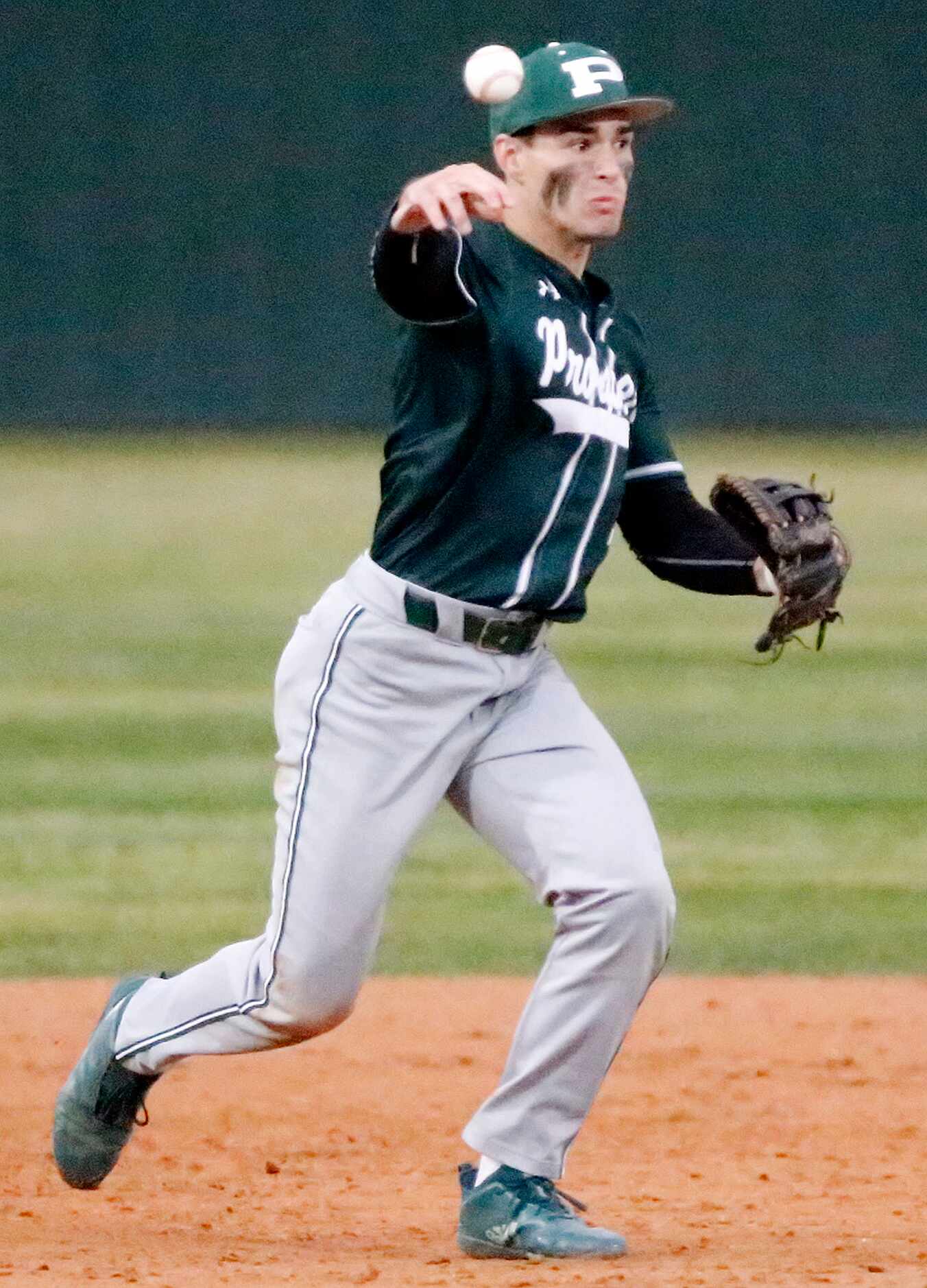 Prosper shortstop Chase Pendley (1) makes the throw for an out in the first inning as Denton...