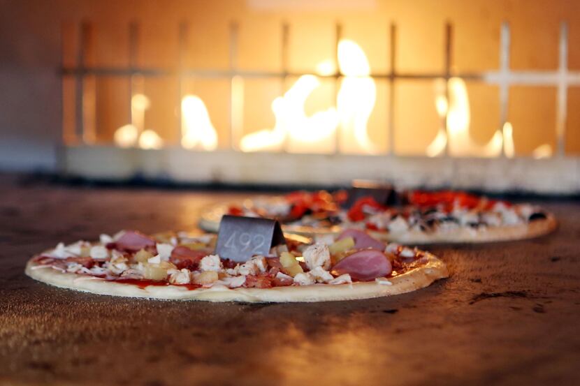 Blaze Pizza uses a hot open-flame oven to cook thin crust pizzas.