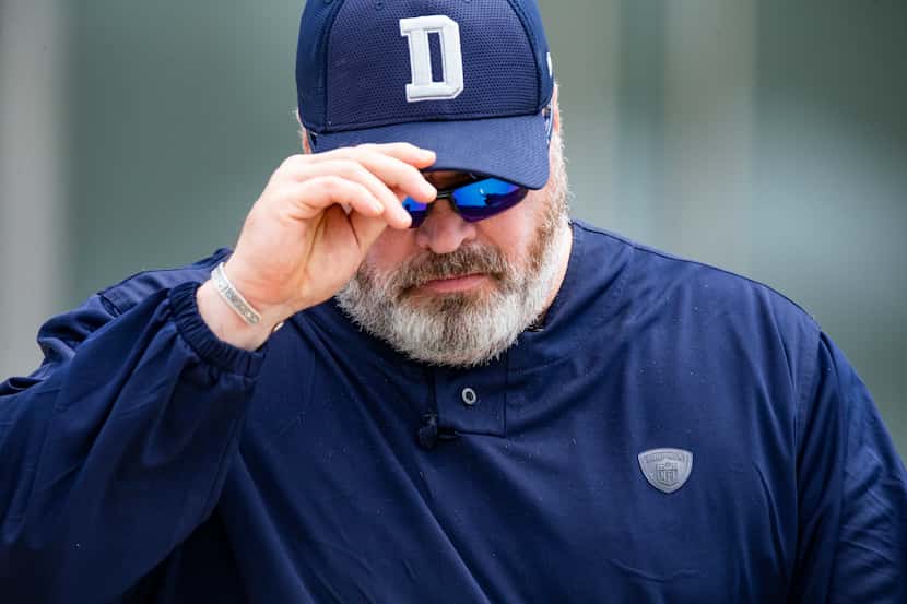 Dallas Cowboys head coach Mike McCarthy adjusts his hat during practice at The Star in...