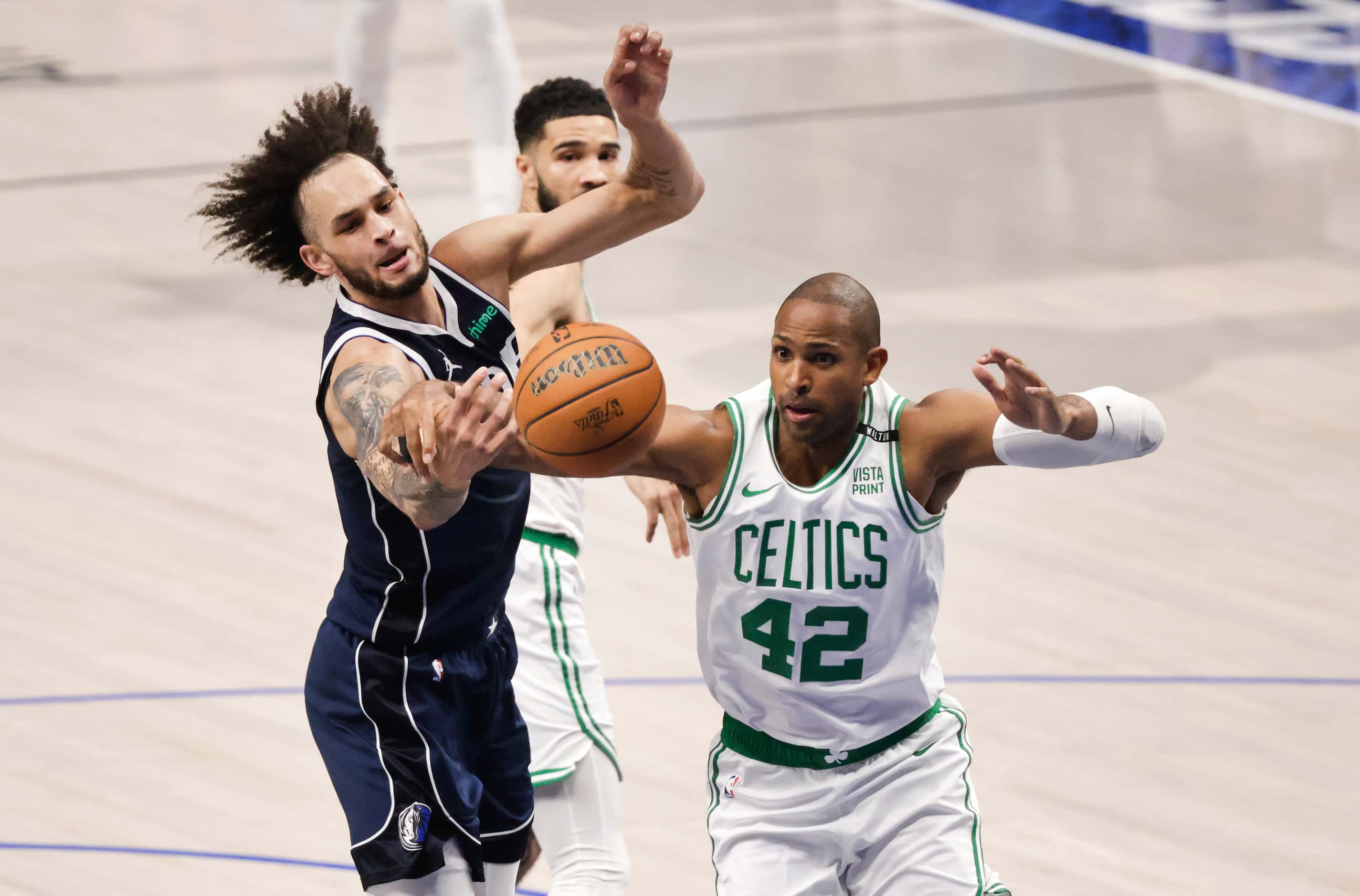 Dallas Mavericks center Dereck Lively II (2) battles Boston Celtics center Al Horford (42)...