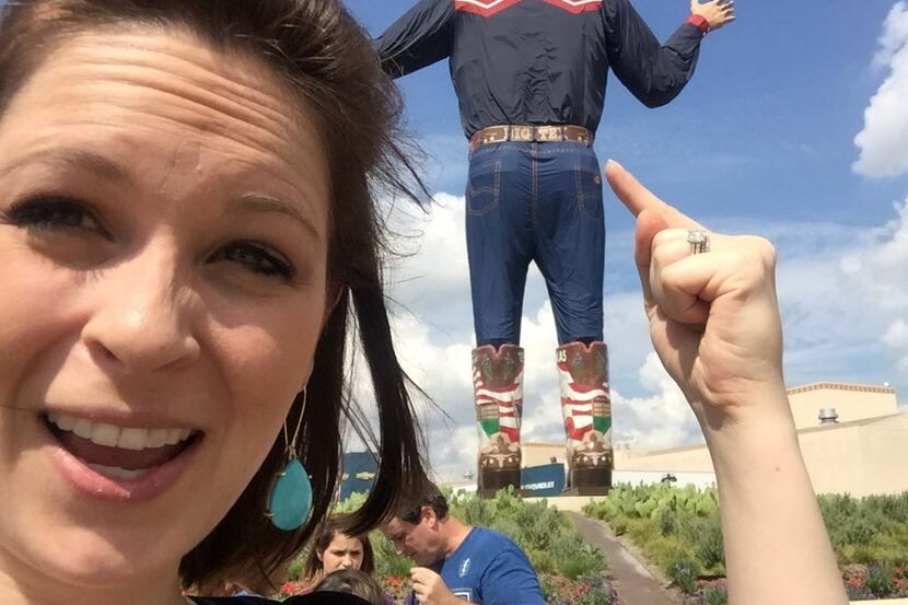 Music editor Sarah Blaskovich goofs off with Big Tex at the State Fair of Texas on Sept. 30,...