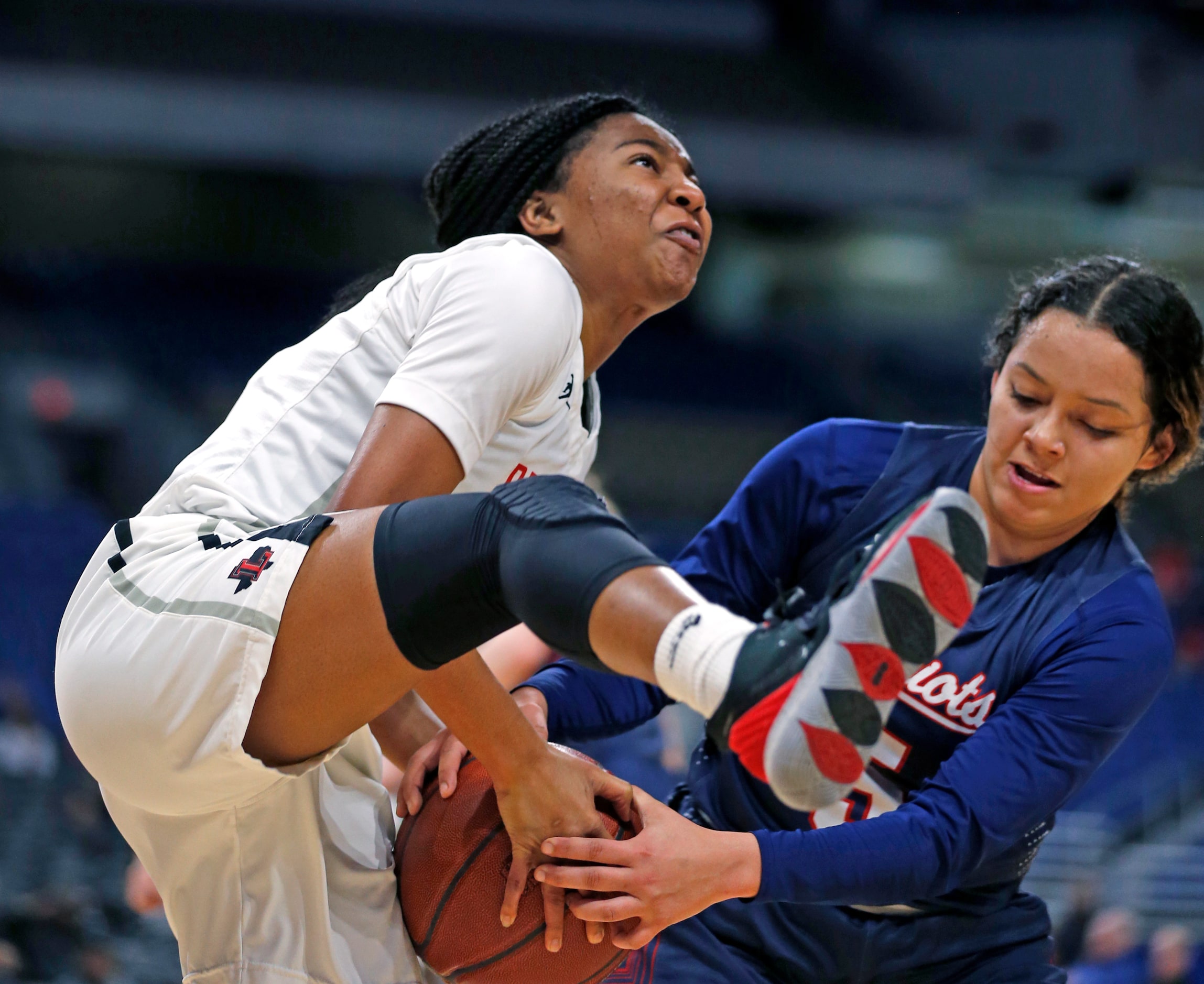 Veterans Memorial guard Vivian Castro #5 ties up Frisco Liberty guard Zoe Junior #5 in a 5A...