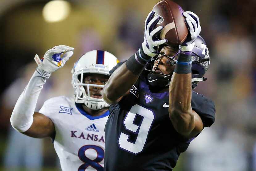 TCU Horned Frogs wide receiver John Diarse (9) hauls in a long pass along the sideline in...