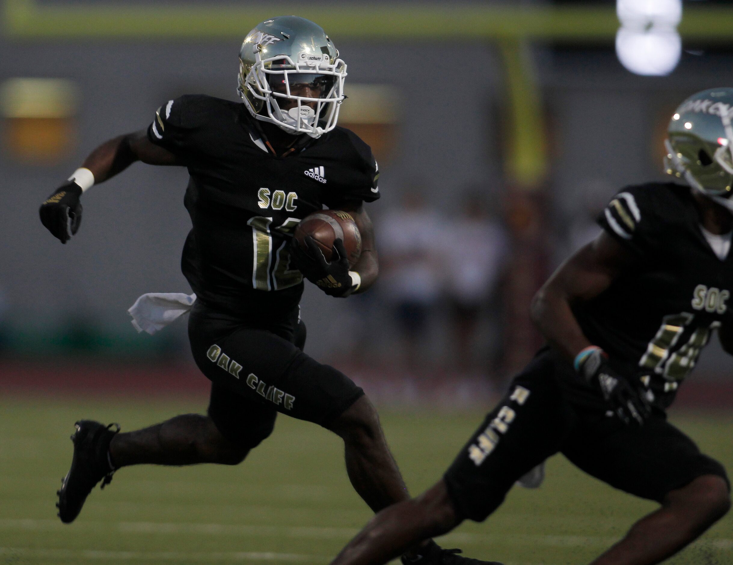 South Oak Cliff running back KeAndra Hollywood (12) follows a block during a first half rush...