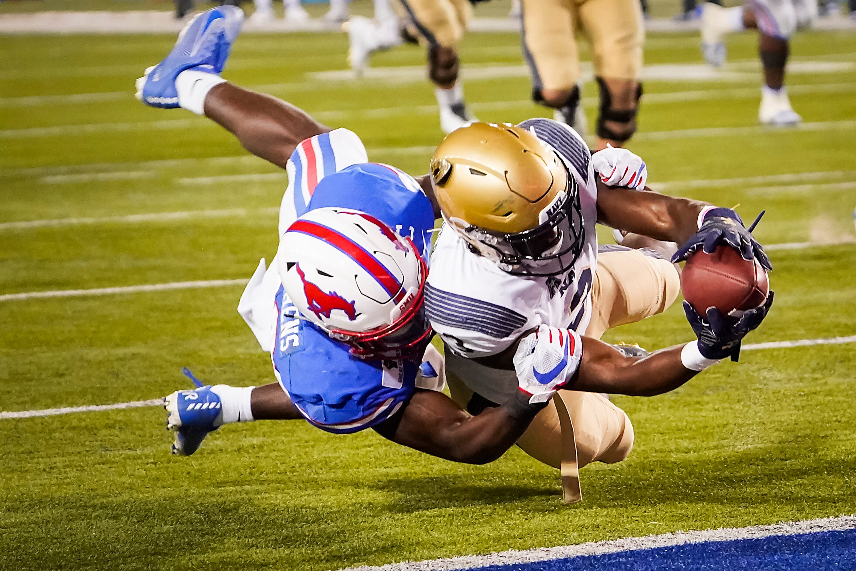 Navy wide receiver Mychal Cooper (3) dives for a touchdown past SMU defensive back Brandon...