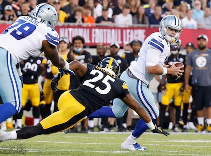 Dallas Cowboys quarterback Garrett Gilbert (3) rolls out against Pittsburgh Steelers safety...