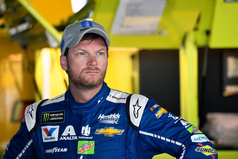FILE - In this Saturday, June 3, 2017 file photo, Dale Earnhardt Jr. looks on in the garage...