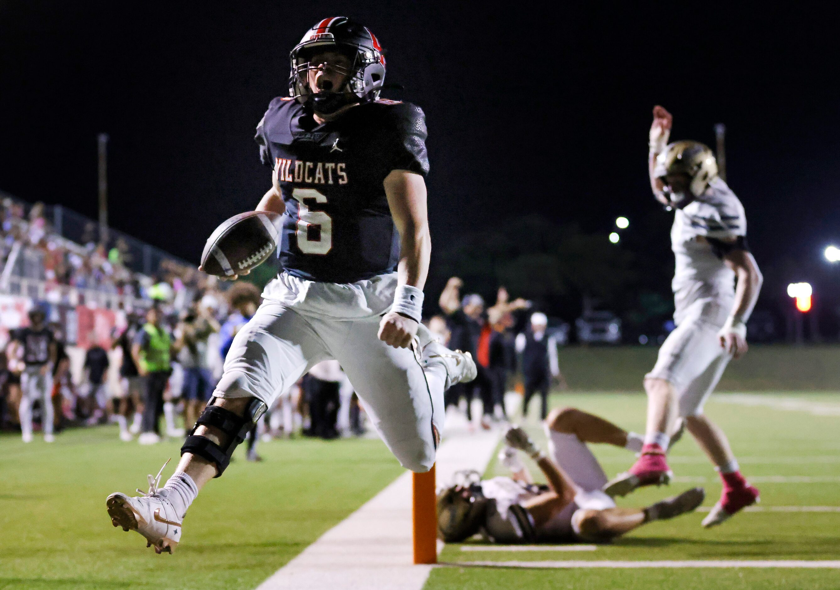 Lake Highlands High quarterback Harrison Day (6) celebrates his rushing touchdown against...