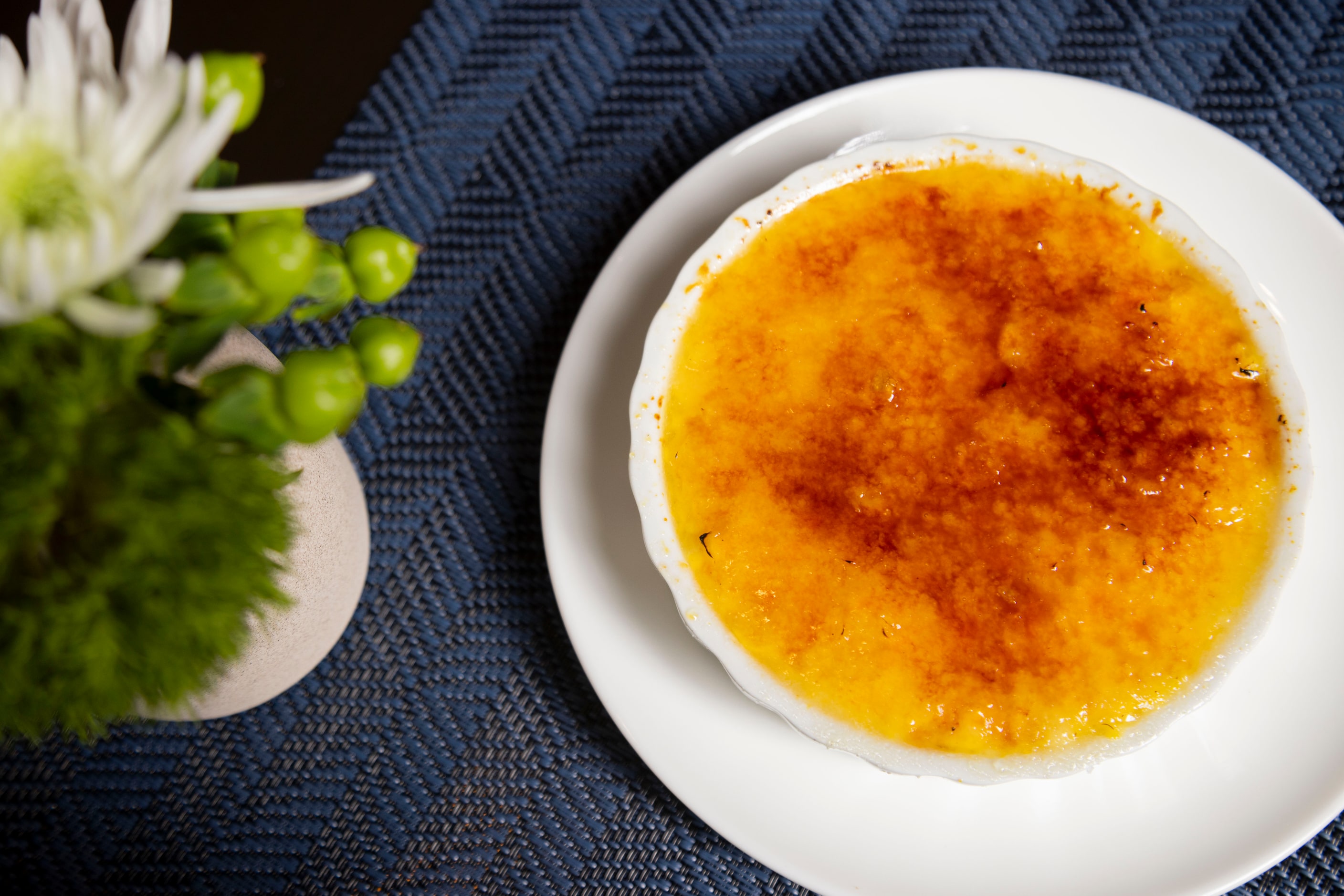 The Corn Crème Brûlée is a side at Wicked Butcher. It tastes like corn pudding. The top is...