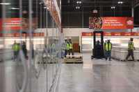 Workers remain inside the upcoming Joe V's Smart Shop at Wheatland Road, on Tuesday, May 14,...