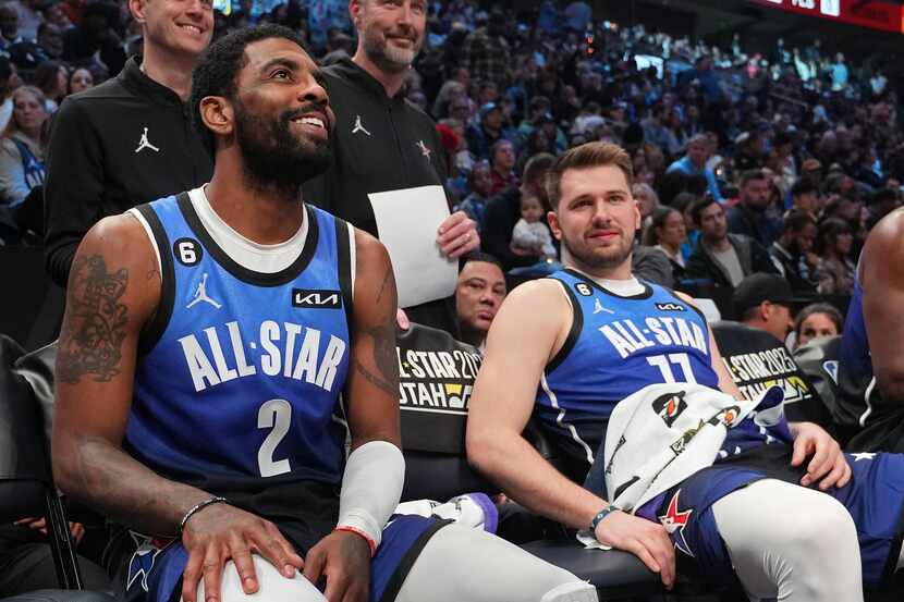 Kyrie Irving #2 and Luka Doncic #77 of Team LeBron smile on the bench during the NBA...
