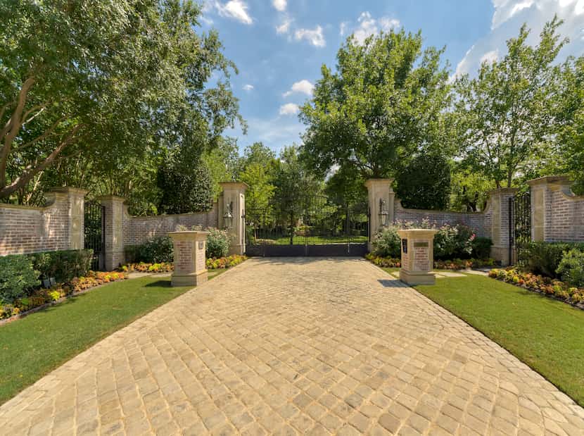 Tumbled limestone creates a stunning drive up to this home's entrance.
