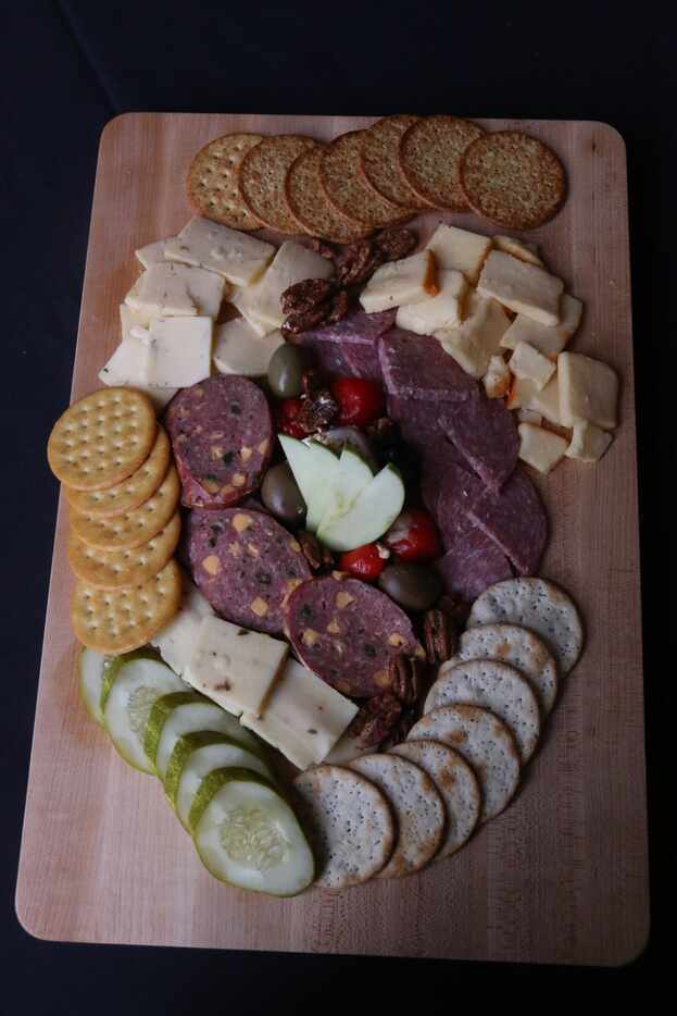 TBD has "boards" on its menu. Here's olives, Peppadews, wildflower honey, goat cheese...