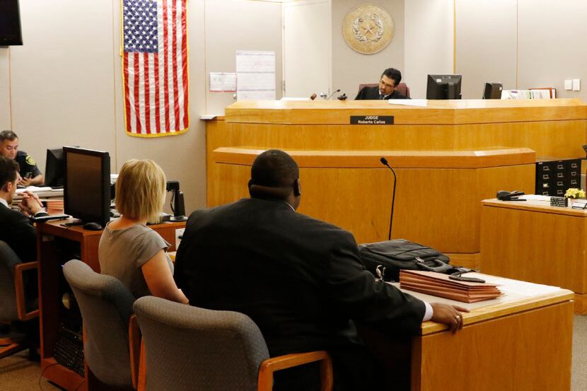 Deputy Rolando Salas (left) sits in Judge Roberto Canas' courtroom during a hearing with...