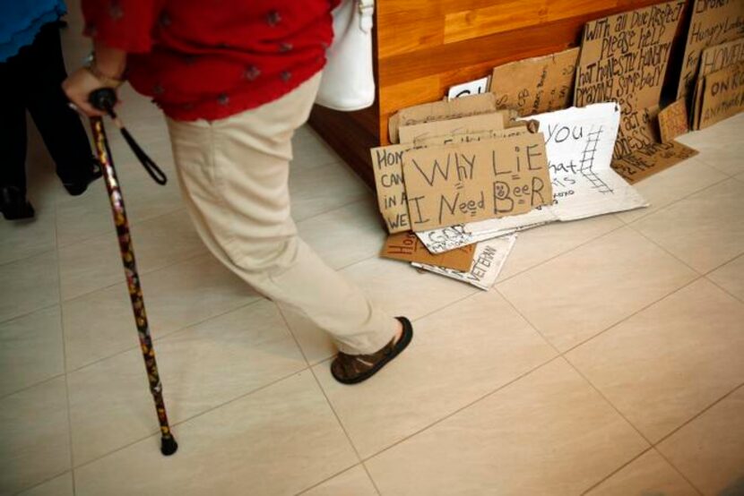 
Signs near the front door at a party welcoming Baronet back from his 31-day cross-country...