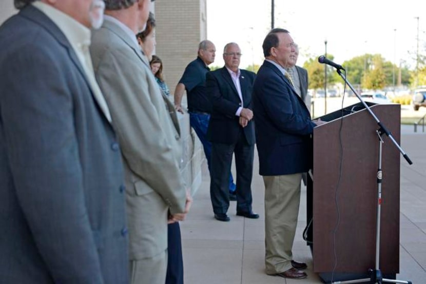 
Rockwall County Commissioner David Magness, speaking during a news conference outside the...