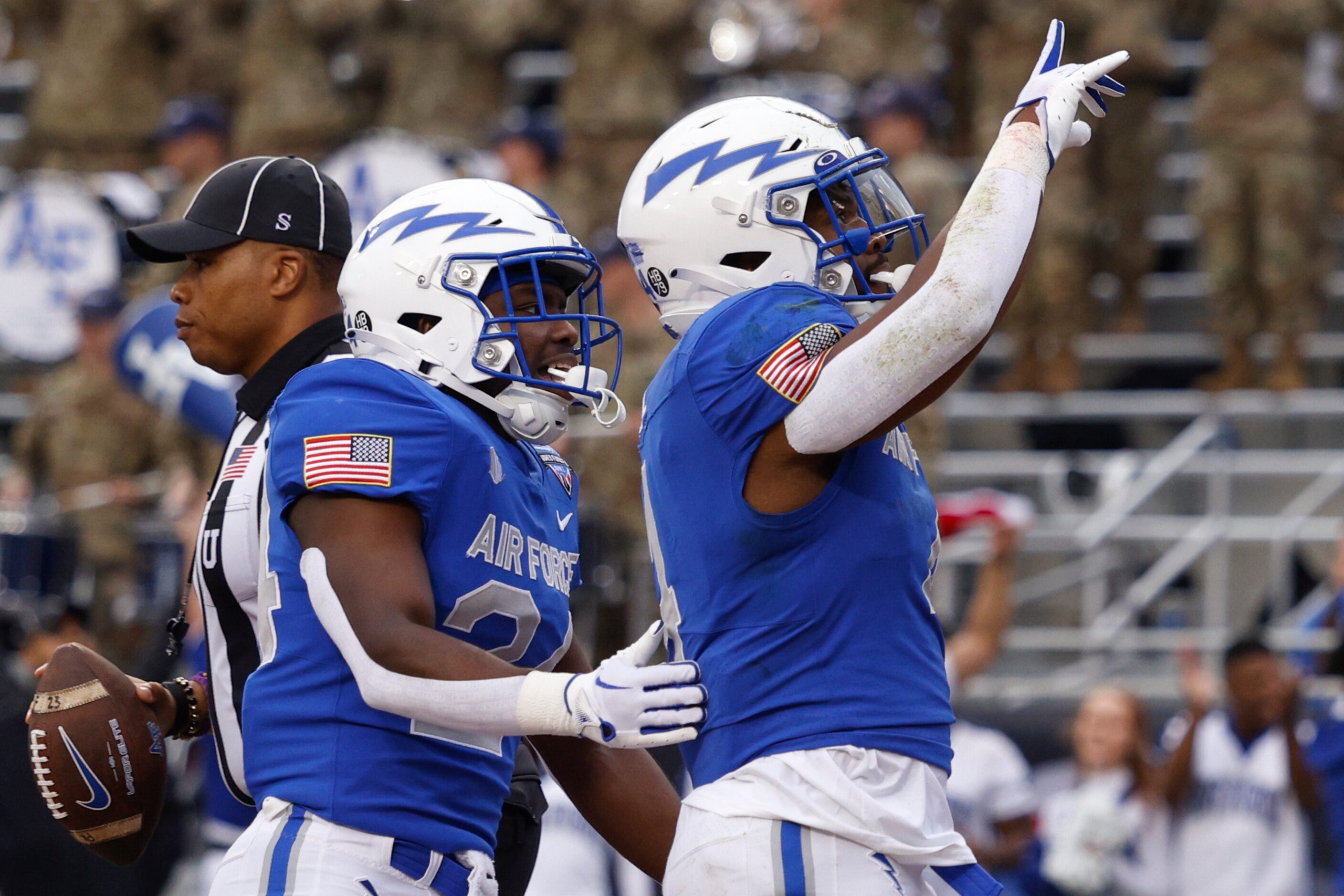 Air Force Falcons fullback Emmanuel Michel (4) celebrates a rushing touchdown alongside...