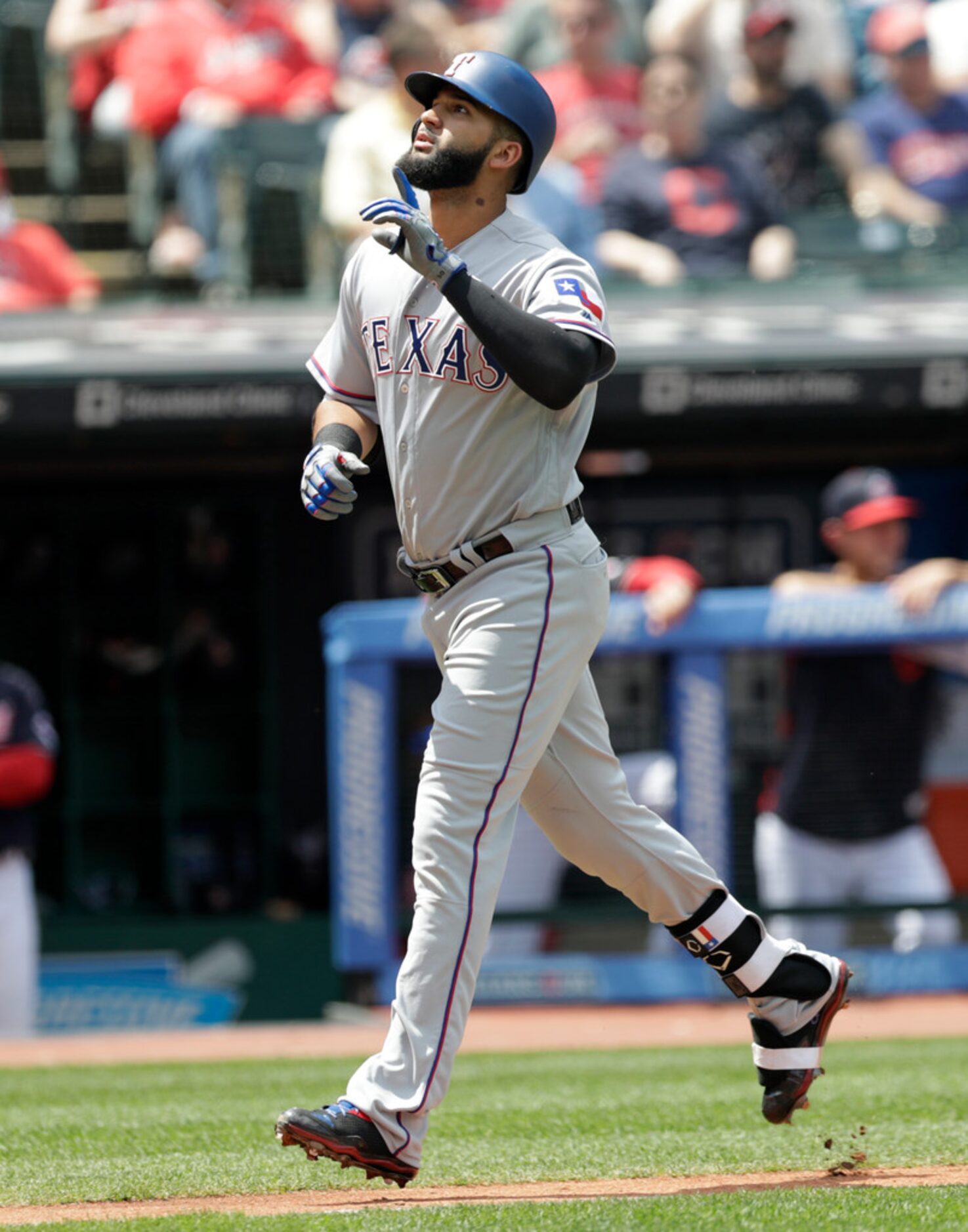 Texas Rangers' Nomar Mazara runs the bases after hitting a solo home run off Cleveland...