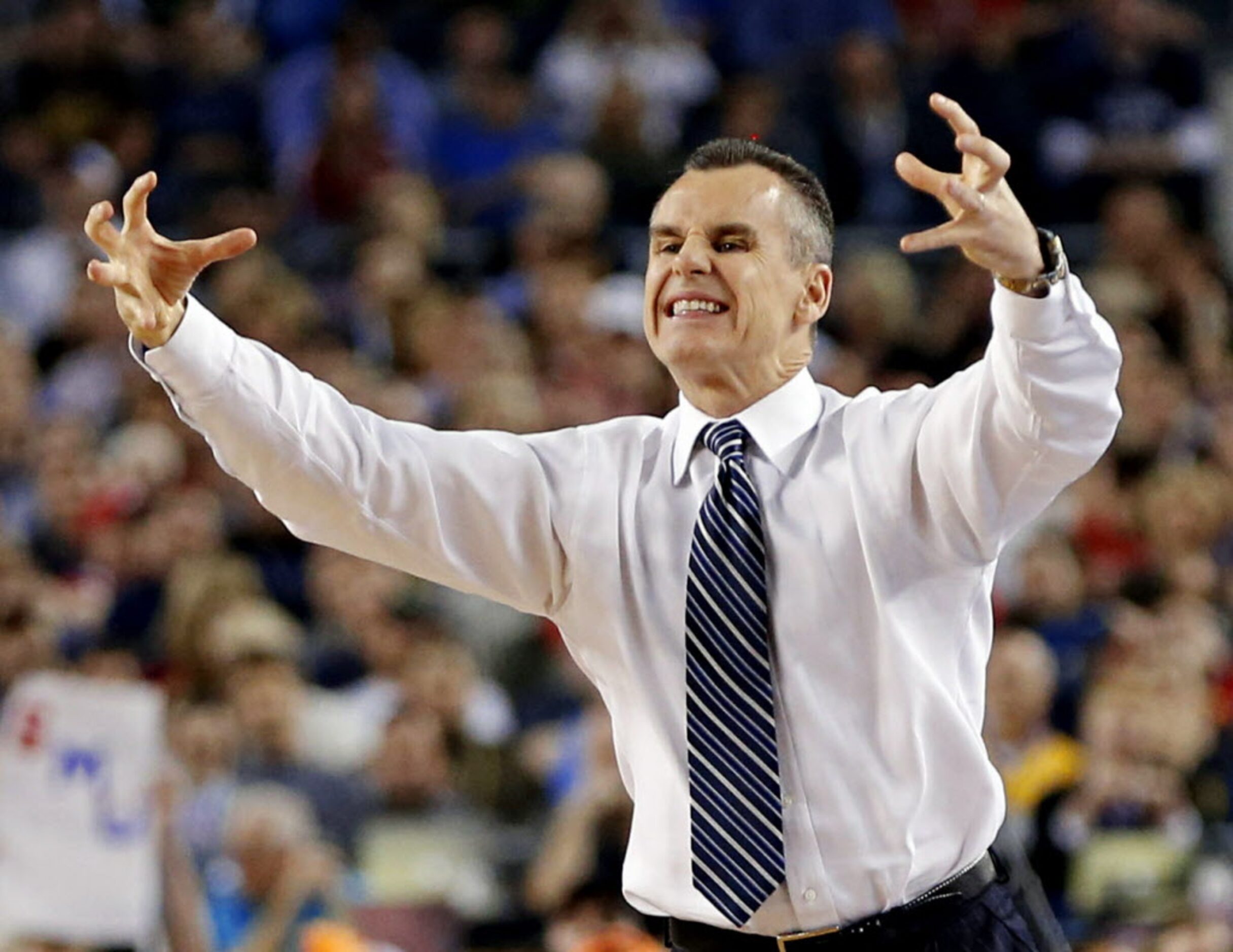 Florida Gators head coach Billy Donovan shows frustration during the second half of their...