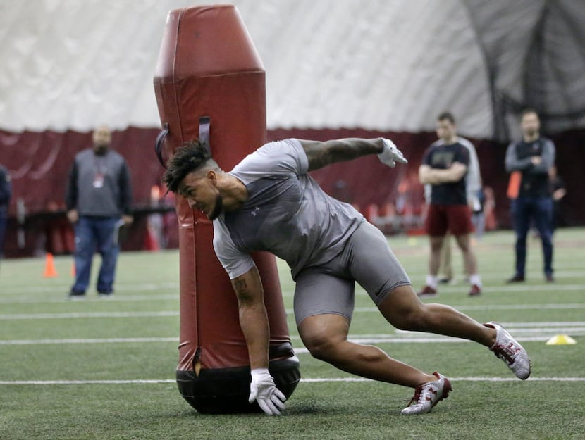 Boston College defensive end Harold Landry performs football field drills during BC Pro Day,...