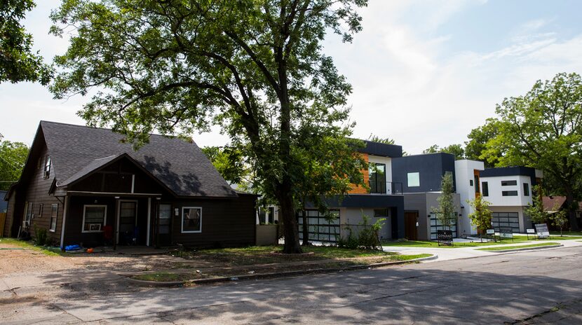 New, modern-style homes were built next door to older homes in the 500 block of Cameron Avenue.