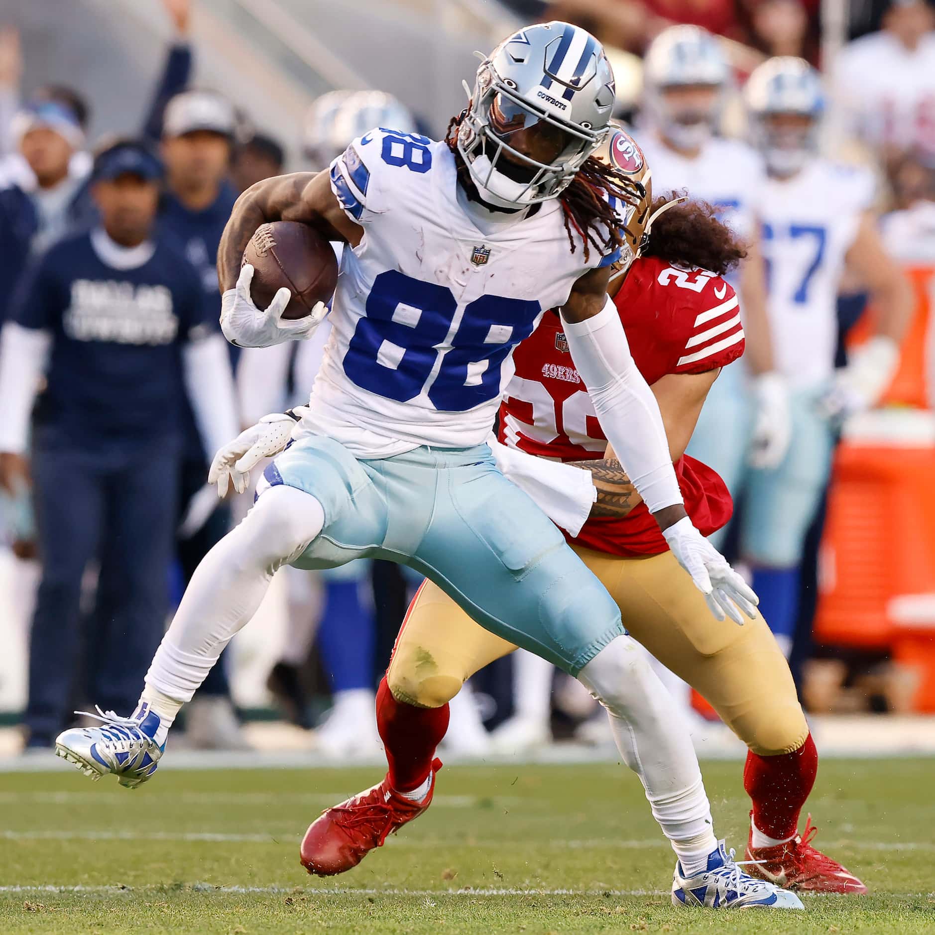 Dallas Cowboys wide receiver CeeDee Lamb (88) spins away from San Francisco 49ers safety...