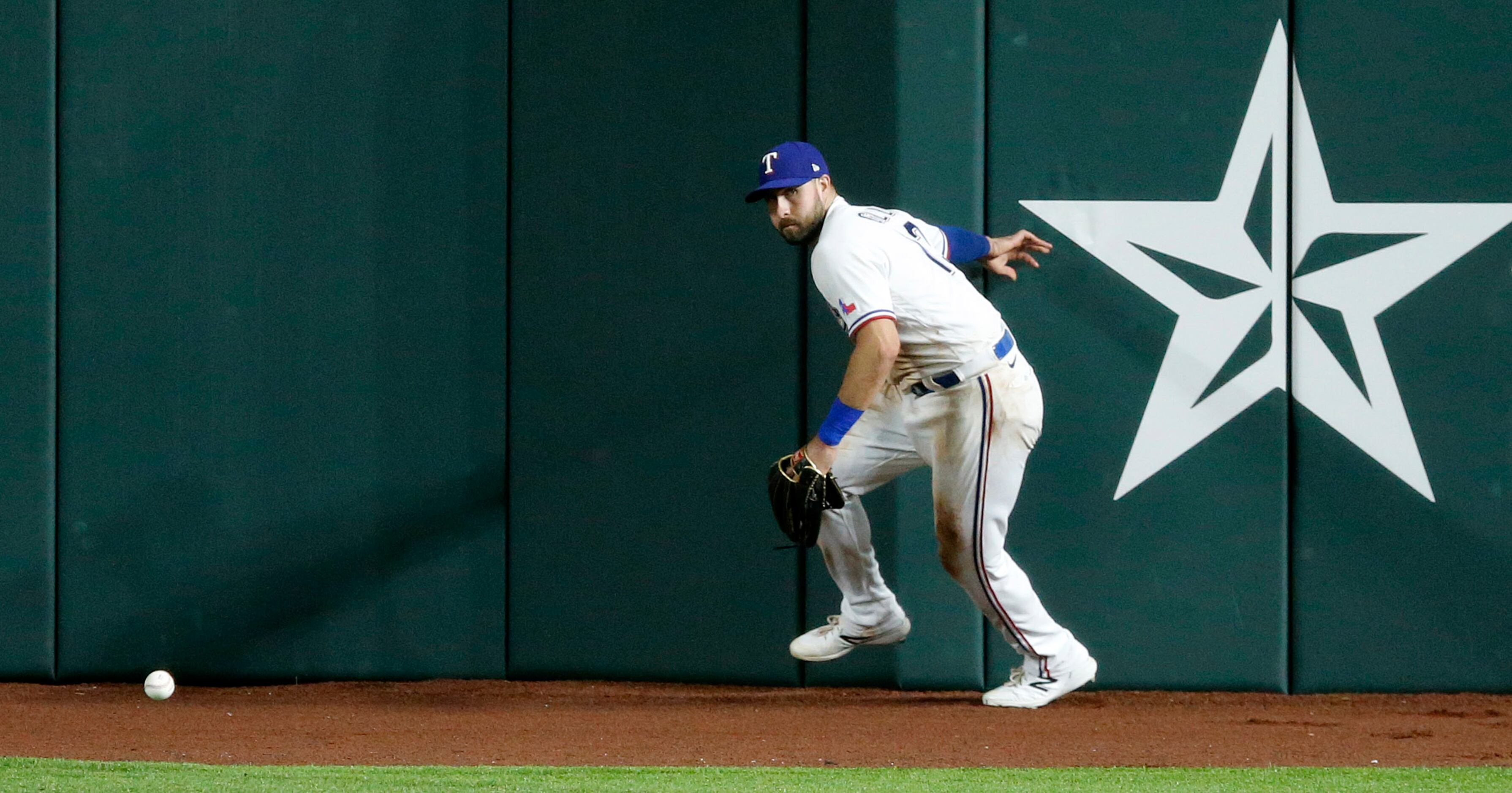 Texas Rangers right fielder Joey Gallo (13) tried to field a fly ball by Arizona...