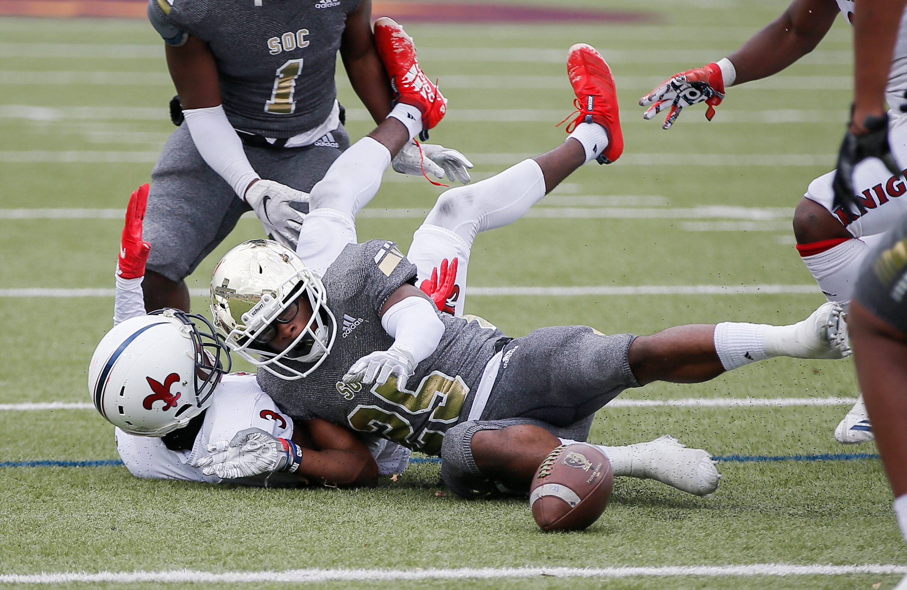 South Oak Cliff senior running back Camren Davis (25) fumbles the ball during the first half...