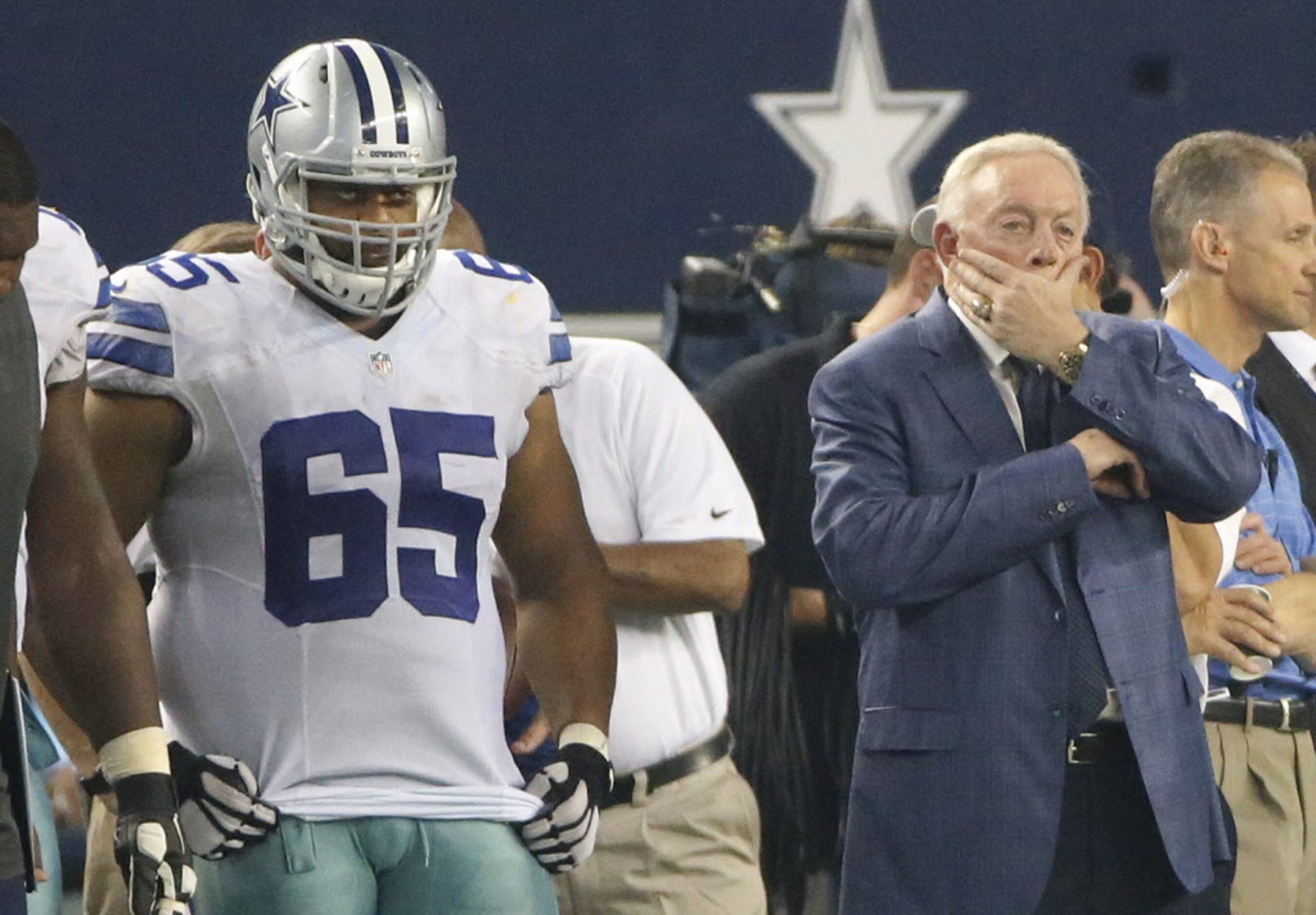 Dallas owner Jerry Jones and Cowboys guard Ronald Leary (65) watch the action from the...