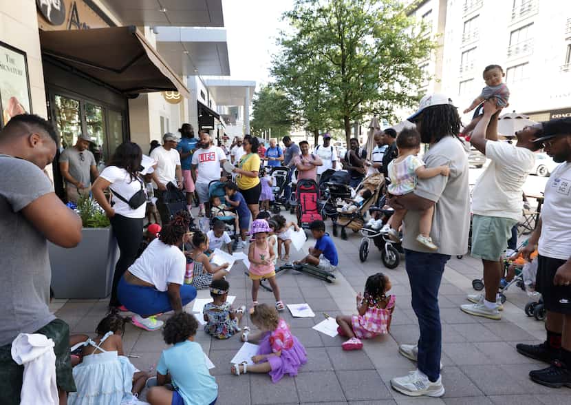Community members participate during a Daddy Stroller Social Club event at Legacy West in...