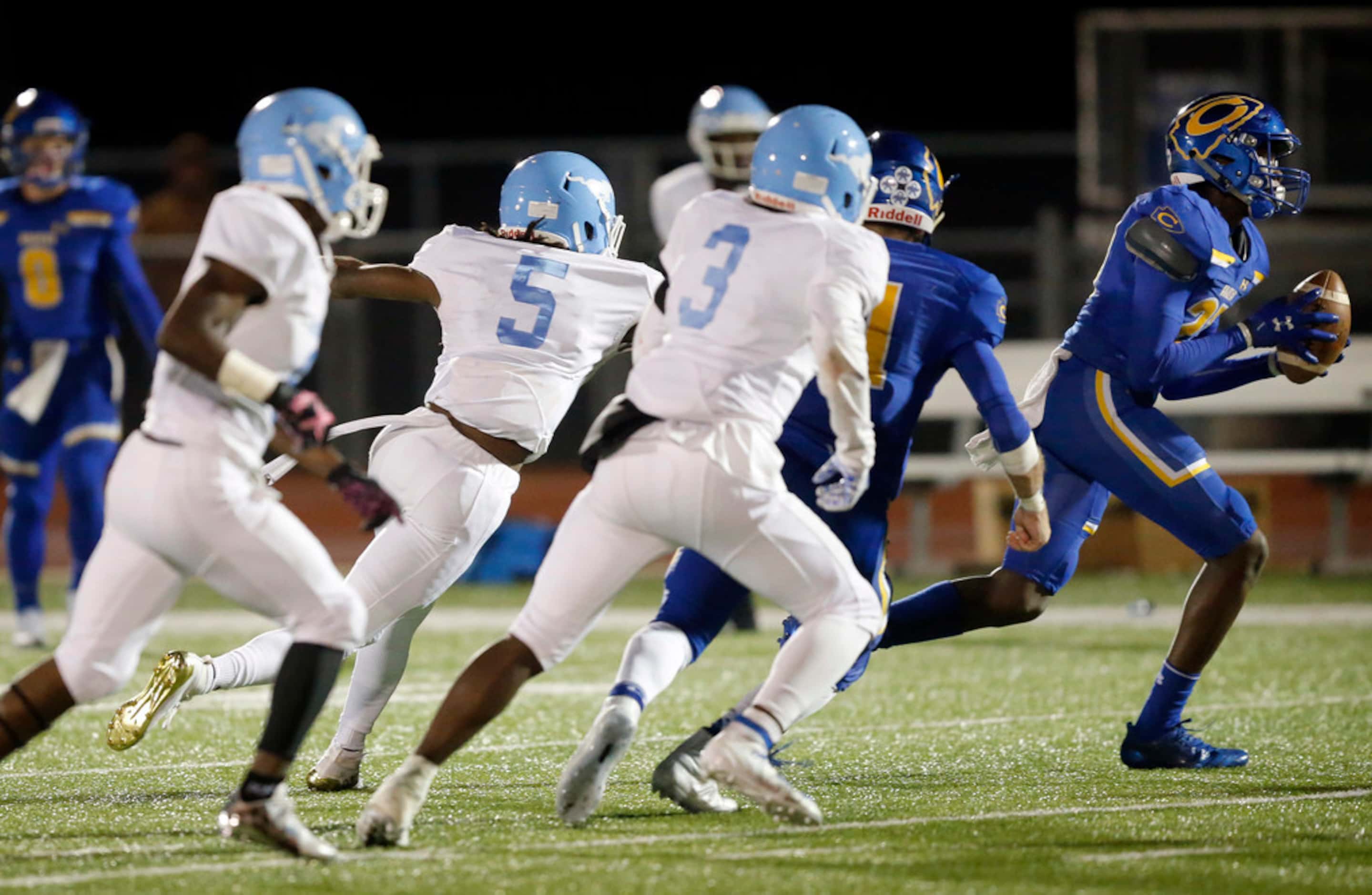 Community High safety Chauncey Chidi (27, right) intercepts a Dallas Roosevelt pass during...
