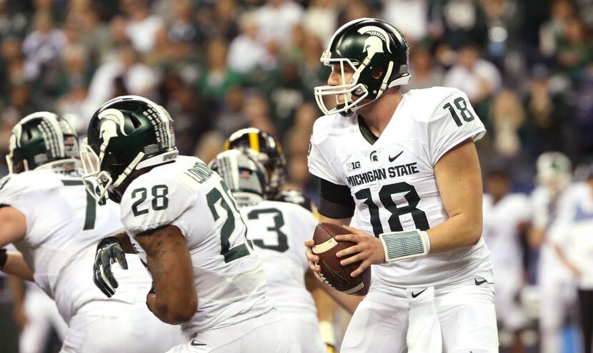 Dec 5, 2015; Indianapolis, IN, USA; Michigan State Spartans quarterback Connor Cook (18)...