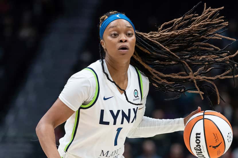 Minnesota Lynx guard Odyssey Sims dribbles the ball during a WNBA basketball game against...