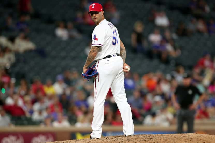 ARLINGTON, TX - SEPTEMBER 13:  Matt Bush #51 of the Texas Rangers pitches against the...