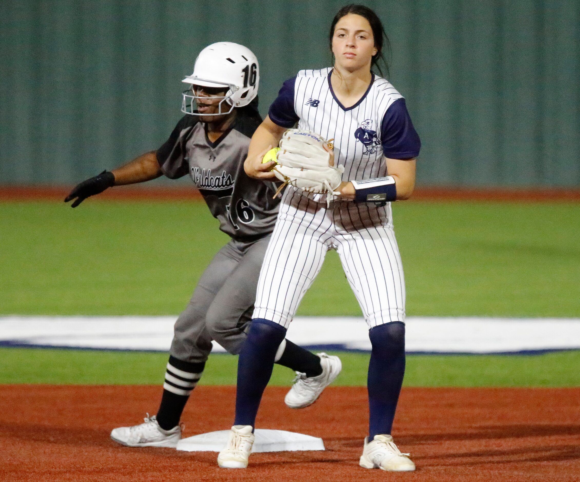 Denton Guyer High School second baseman Bre Jackson (16) stands safely on second base as...