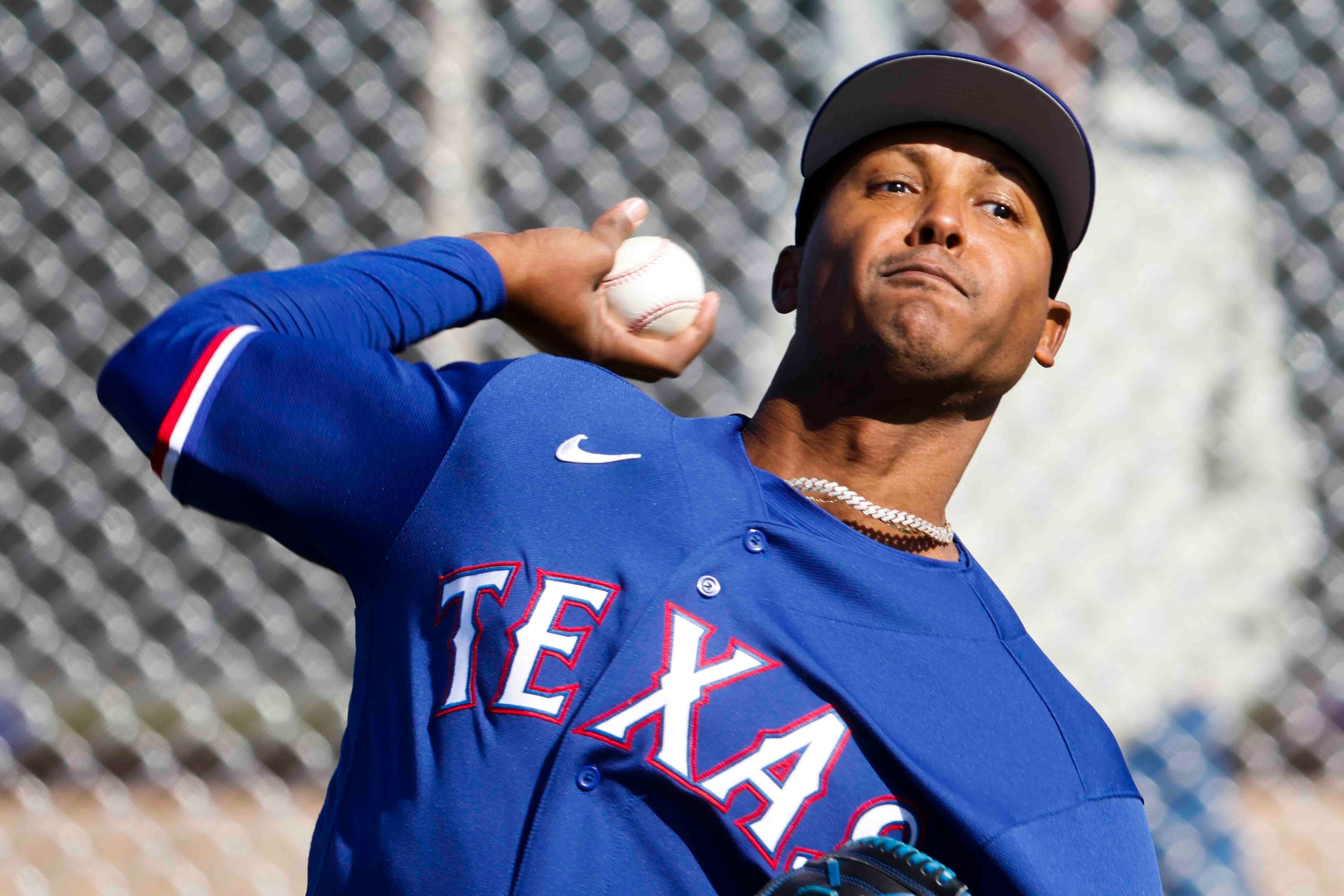 Texas Rangers right handed pitcher Jose Leclerc throws a pitch during a spring training...