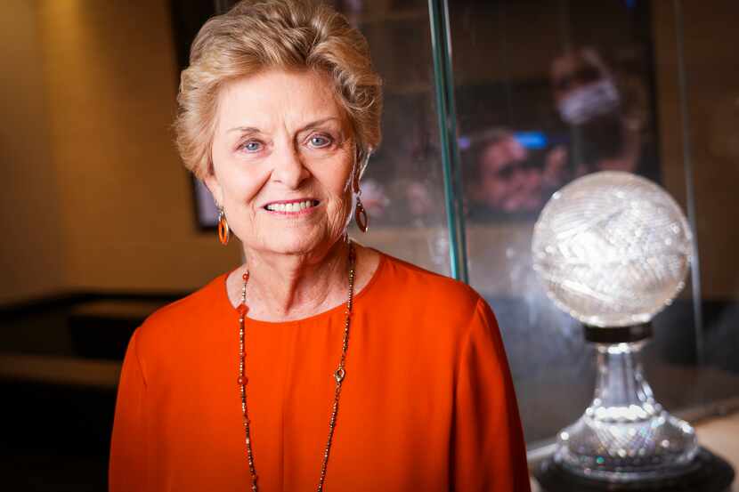 Legendary former Texas women's basketball coach Jody Conradt photographed with the trophy...