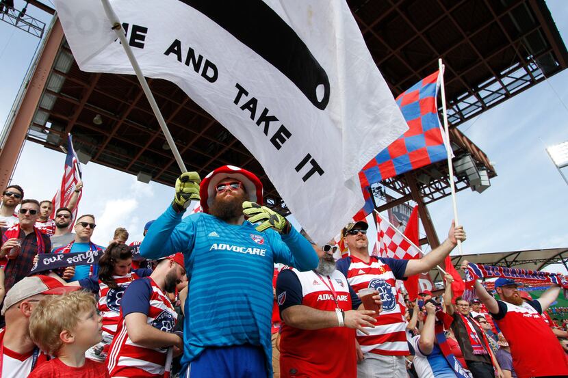 Enthusiastic FC Dallas fans welcome their team to the field prior to the start of their game...