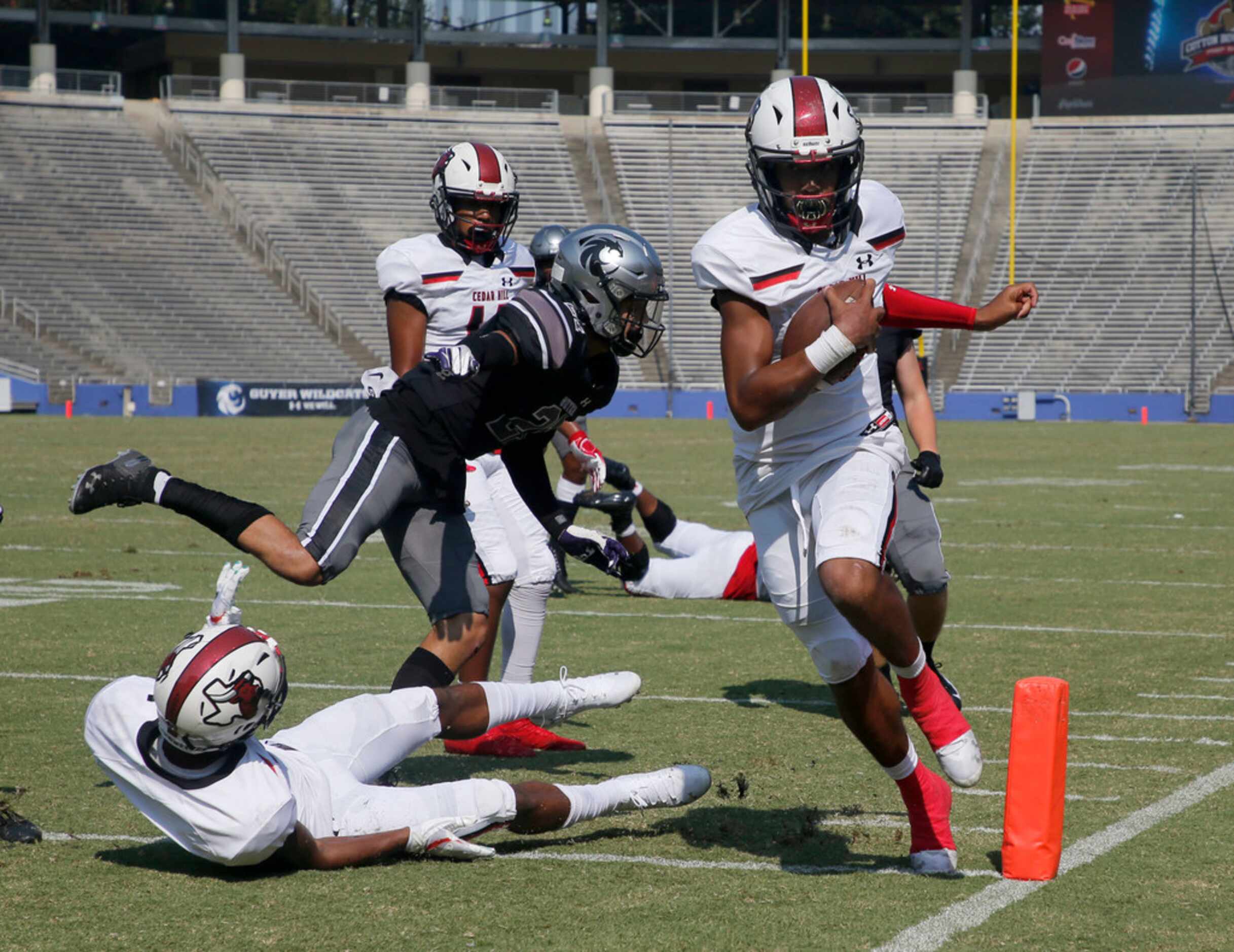 Cedar Hill quarterback Kaidon Salter (7) scores a rushing touchdown against Denton Guyer...