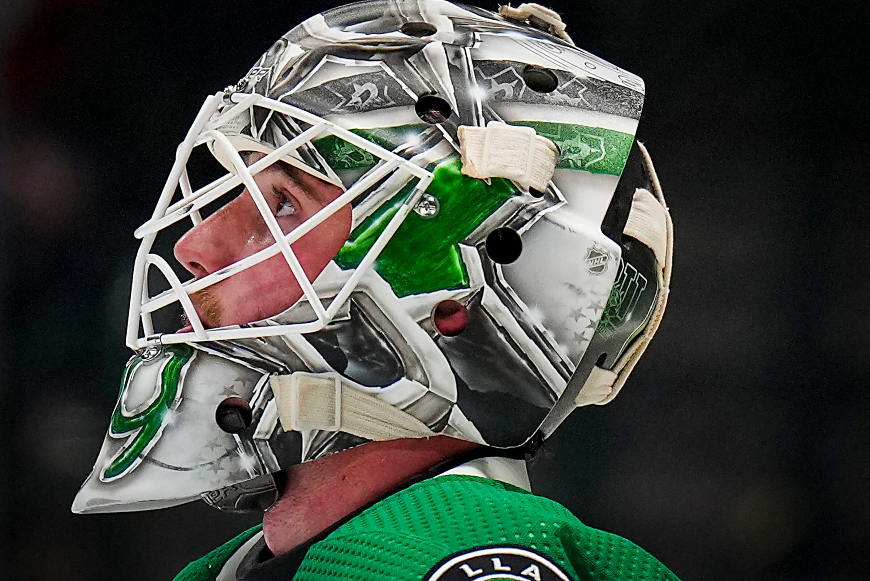 Dallas Stars goaltender Jake Oettinger looks up during a timeout during the second period of...