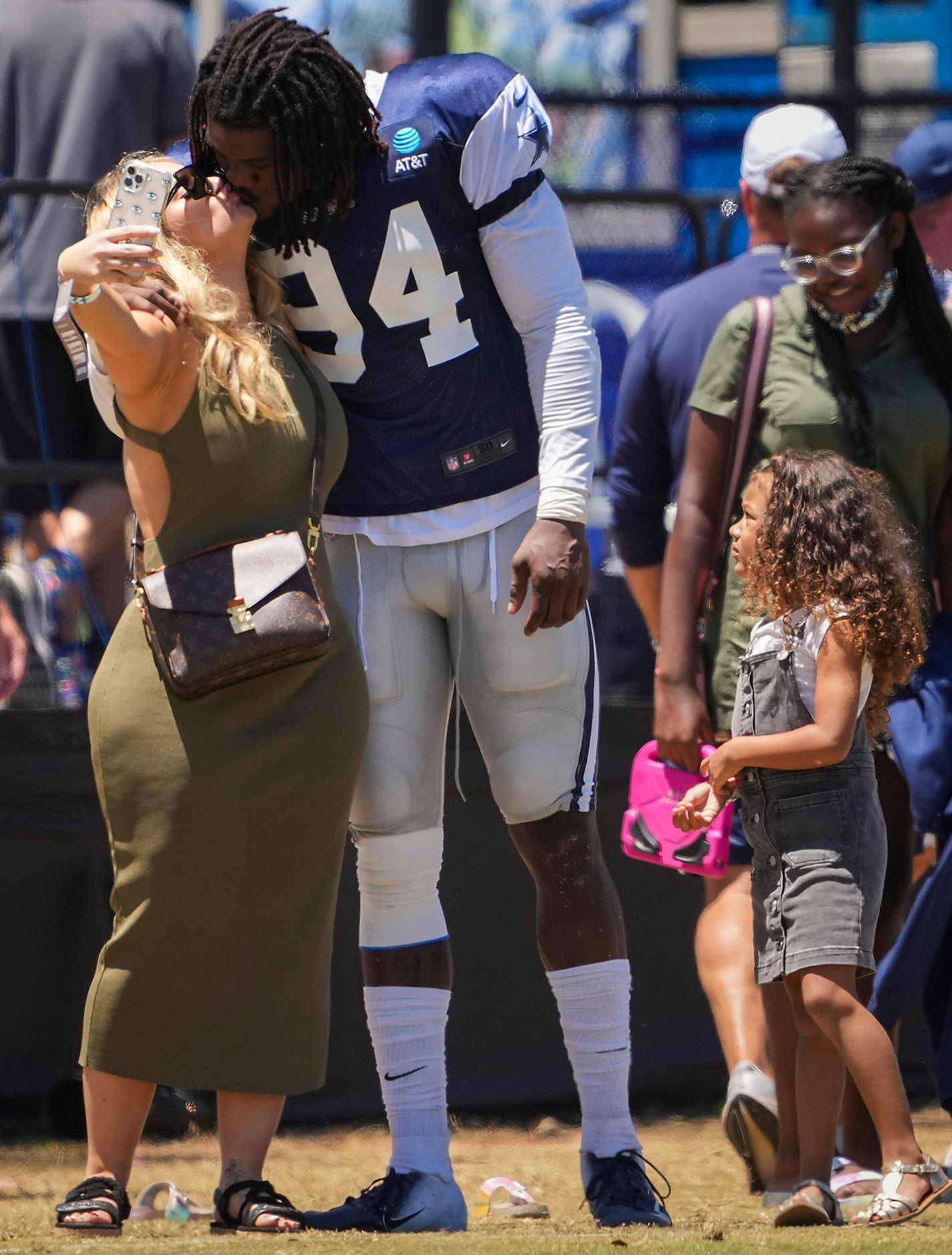 Dallas Cowboys defensive end Randy Gregory  kisses his girlfriend Nancy as they take a...