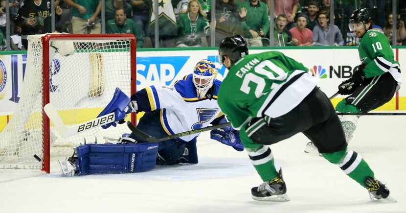 Dallas Stars center Cody Eakin (20) takes a shot on St. Louis Blues goalie Brian Elliott (1)...