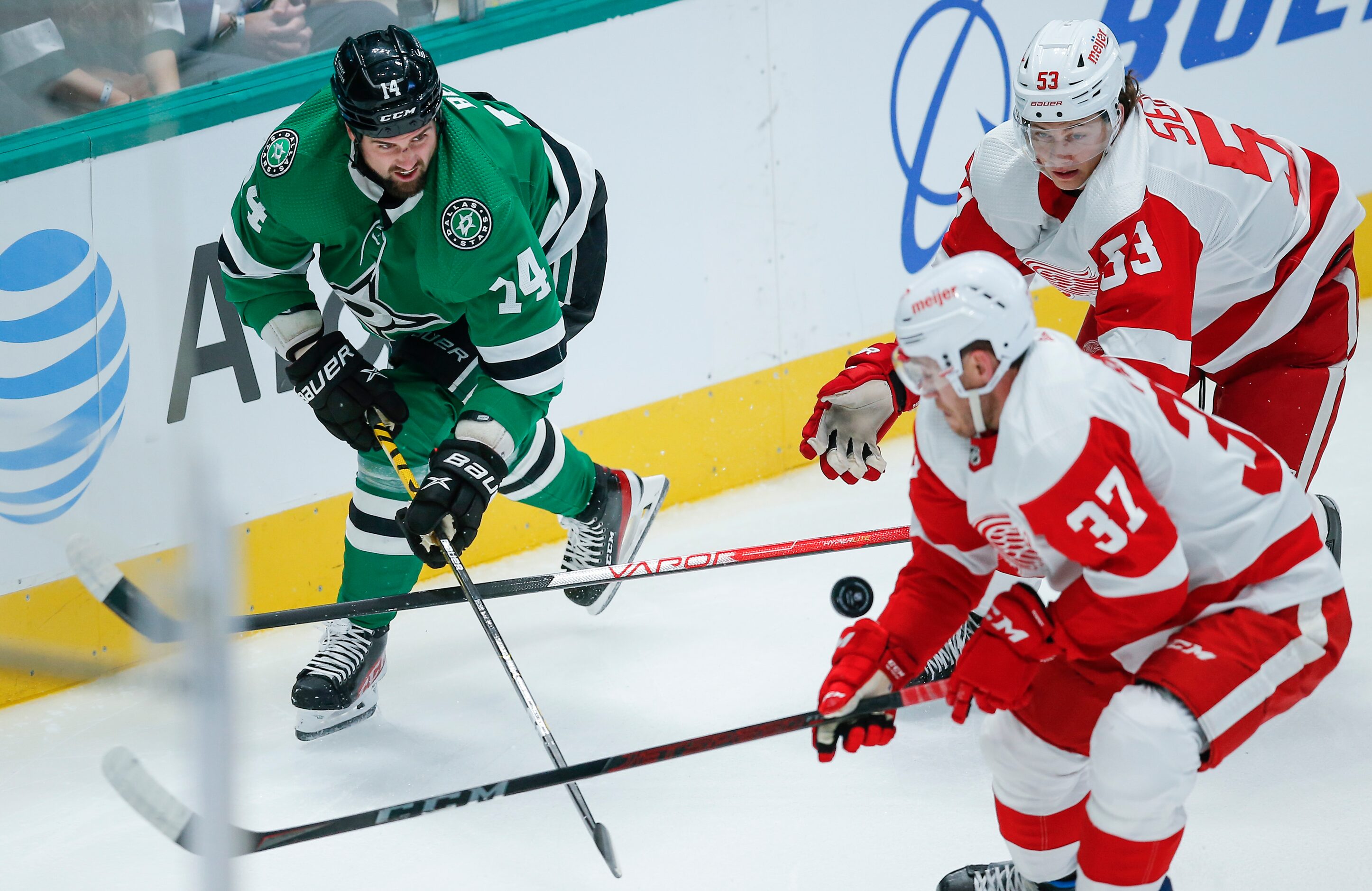 Dallas Stars forward Jamie Benn (14) battles Detroit Red Wings forward Carter Rowney (37)...