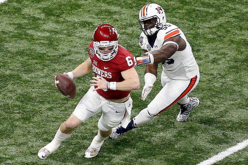 NEW ORLEANS, LA - JANUARY 02:  Baker Mayfield #6 of the Oklahoma Sooners avoids a tackle by...
