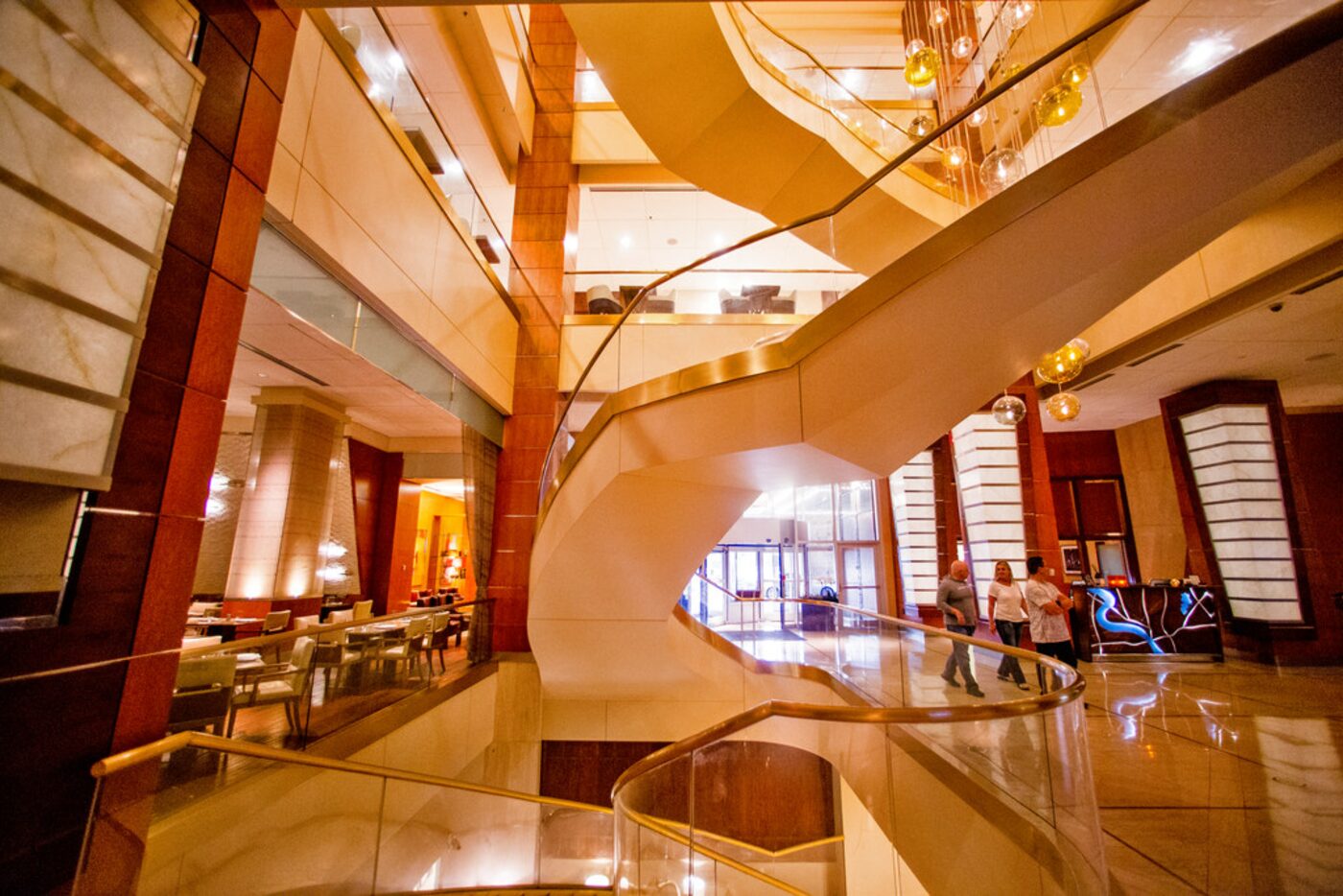 Patrons walk through the atrium at Renaissance Dallas Hotel.