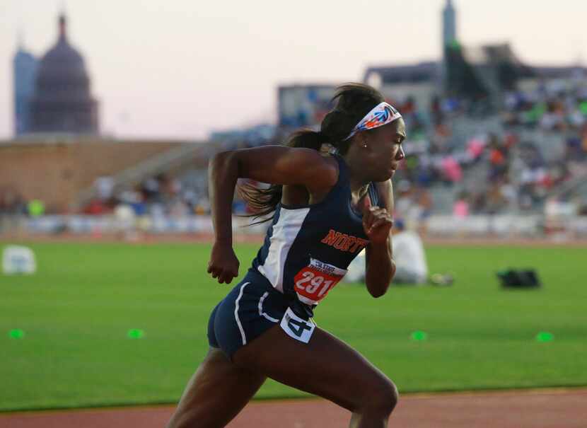 McKinney North's Jania Martin runs in the class 5A girls 400-meter run during the UIL state...