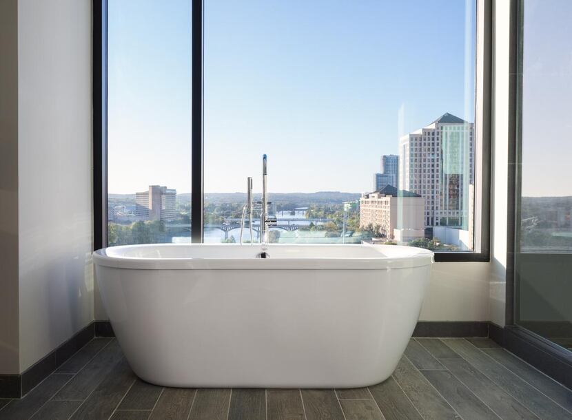 Some of  the rooms  feature a soaking tub with a view of downtown.
