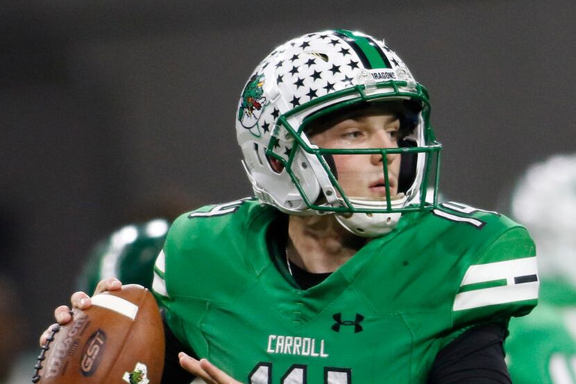 Southlake Carroll quarterback Will Bowers (14) looks to make a long pass downfield during...