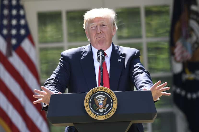 US President Donald Trump announces his decision on the Paris Climate Accords in the Rose...